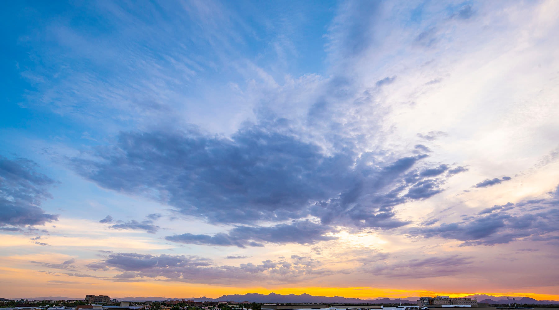 Experience Life at Carter a sunset with clouds